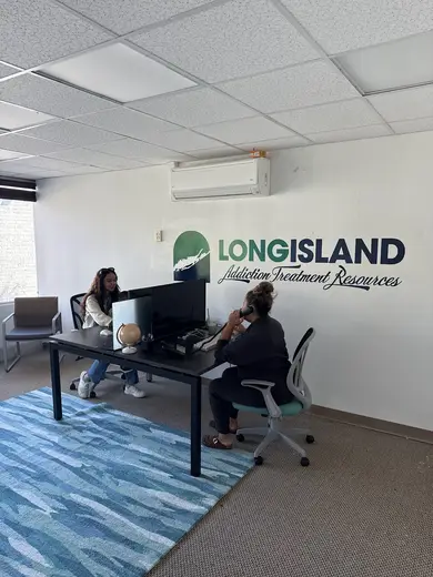 Bright office space with two women consulting at Long Island Addiction Treatment Resources, intensive outpatient program in Buffalo.