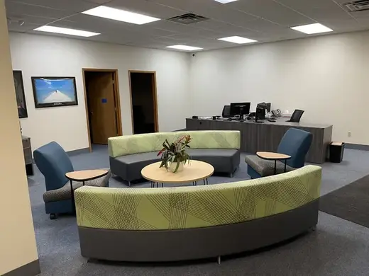 Inviting seating area with modern furniture at ARCA Asset Recovery Company of America, a sober living home in Buffalo.