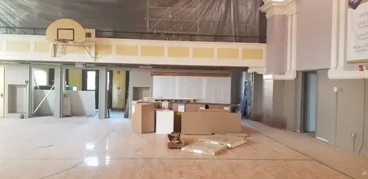 Spacious gymnasium with basketball hoop at Gerard Place, a sober living home in Buffalo.